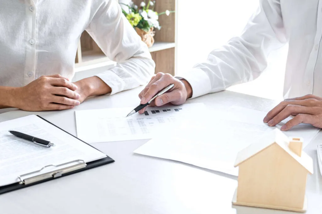 A licensed agent comparing insurance plans with a client